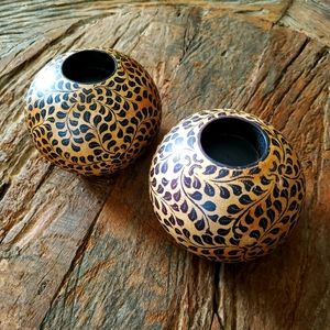 Hand drawn batik decorated round wooden shaped candle or tea light holders.